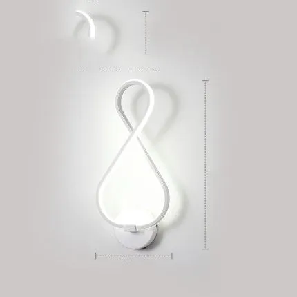 Nordic minimalist LED wall lamp with silicone shade in black finish mounted beside bed