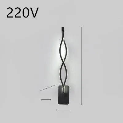 Nordic minimalist LED wall lamp with silicone shade in black finish mounted beside bed