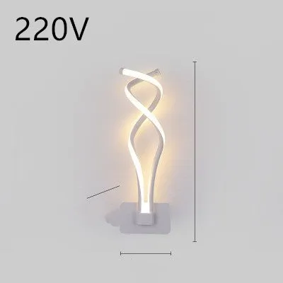 Nordic minimalist LED wall lamp with silicone shade in black finish mounted beside bed