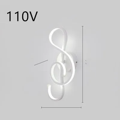 Nordic minimalist LED wall lamp with silicone shade in black finish mounted beside bed