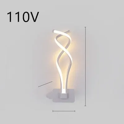 Nordic minimalist LED wall lamp with silicone shade in black finish mounted beside bed