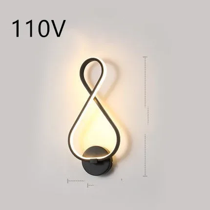 Nordic minimalist LED wall lamp with silicone shade in black finish mounted beside bed