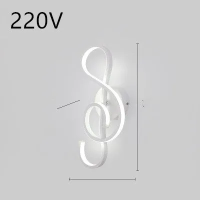 Nordic minimalist LED wall lamp with silicone shade in black finish mounted beside bed