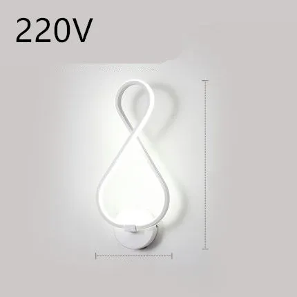 Nordic minimalist LED wall lamp with silicone shade in black finish mounted beside bed