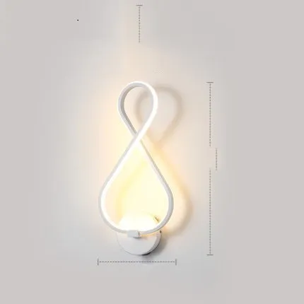 Nordic minimalist LED wall lamp with silicone shade in black finish mounted beside bed