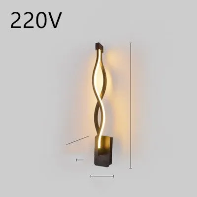 Nordic minimalist LED wall lamp with silicone shade in black finish mounted beside bed