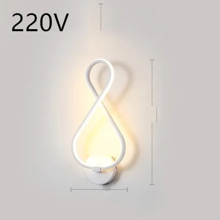 Nordic minimalist LED wall lamp with silicone shade in black finish mounted beside bed