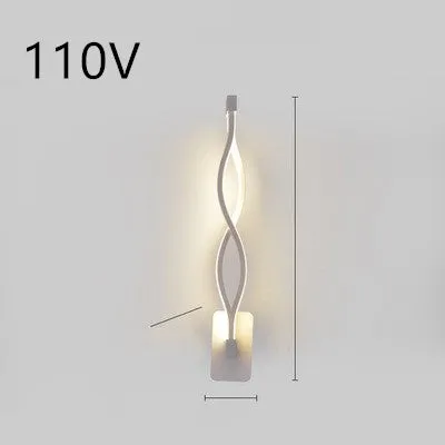 Nordic minimalist LED wall lamp with silicone shade in black finish mounted beside bed