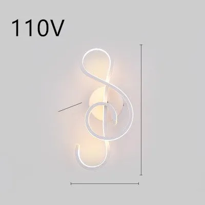 Nordic minimalist LED wall lamp with silicone shade in black finish mounted beside bed