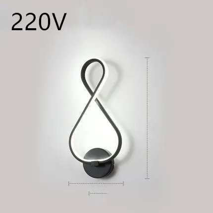 Nordic minimalist LED wall lamp with silicone shade in black finish mounted beside bed