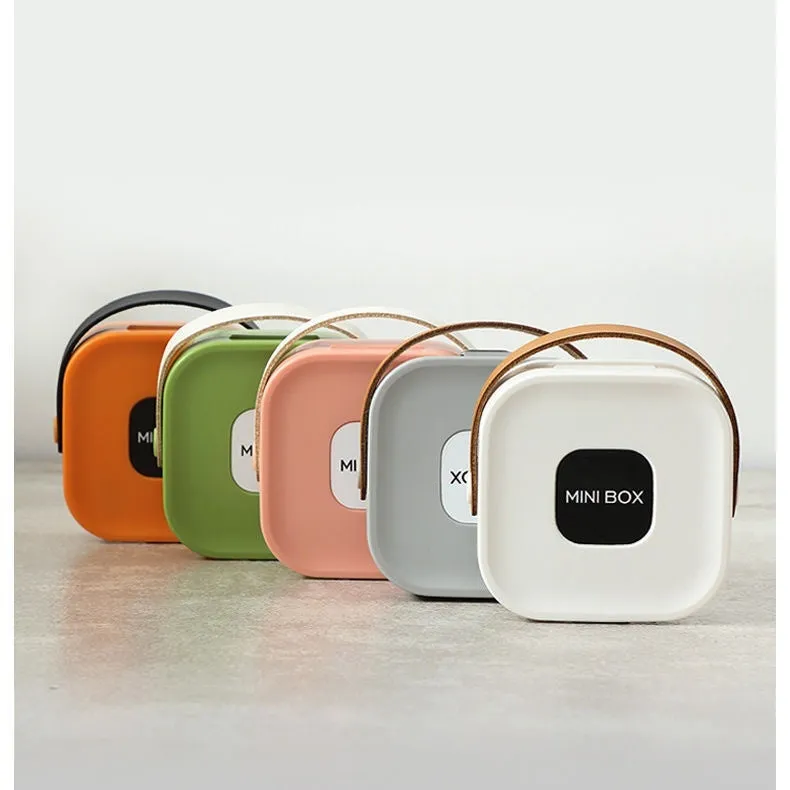 Medium solid-colour polypropylene storage box with lid for cables and headphones.
