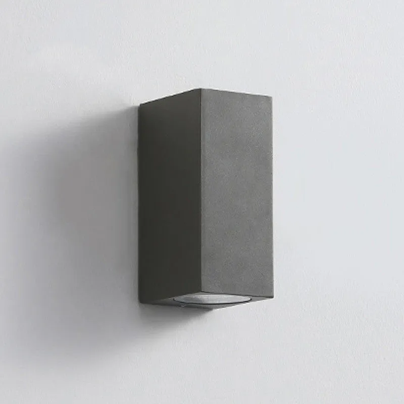 Modern aluminium LED wall lamp in a black finish mounted on a wall.