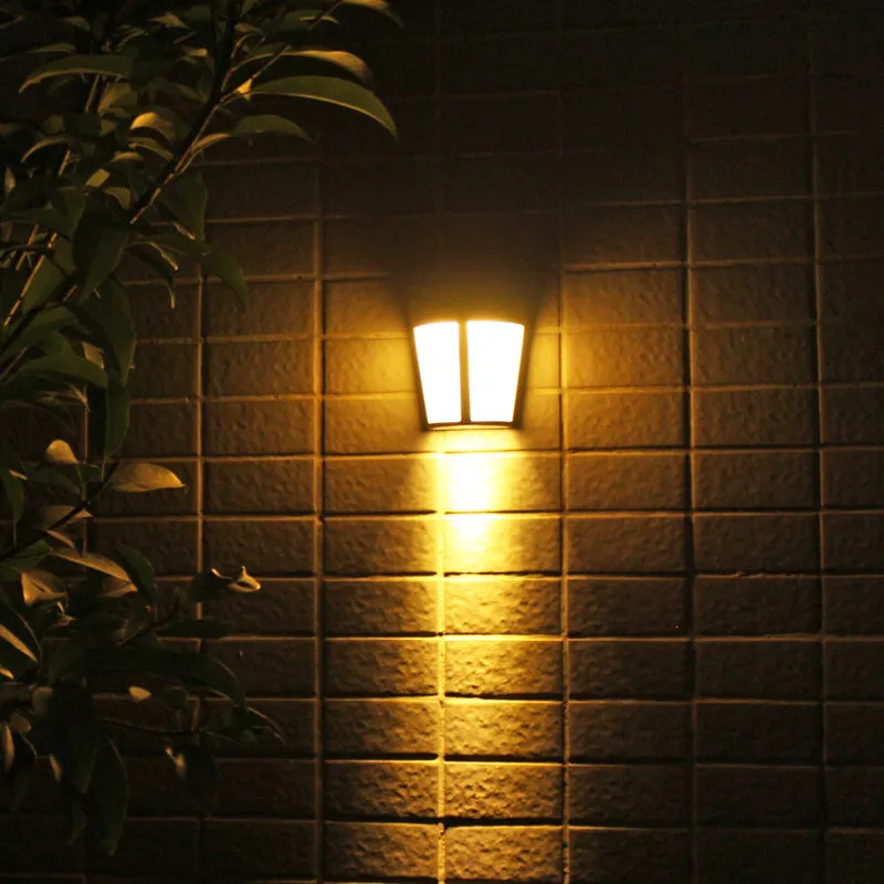 Solar wall lamp with 6 LED lights in IP65 waterproof housing for outdoor garden and courtyard illumination