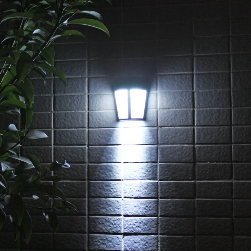 Solar wall lamp with 6 LED lights in IP65 waterproof housing for outdoor garden and courtyard illumination