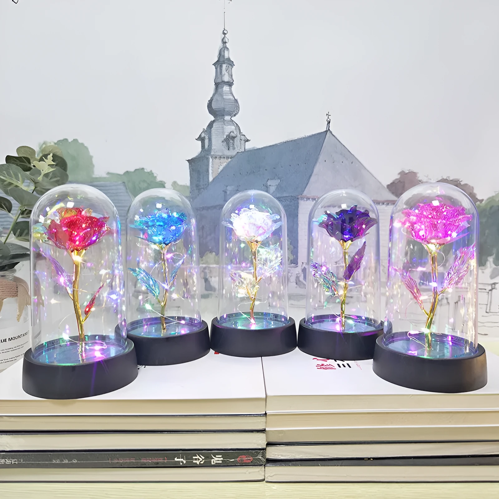 Small glass cover night lamp with plastic base and multiple LED colour options on a table.