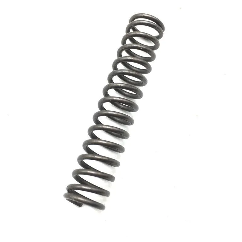 Set of metal pneumatic belt machine accessories including rollers, blades, a switch, and couplings on a workbench.