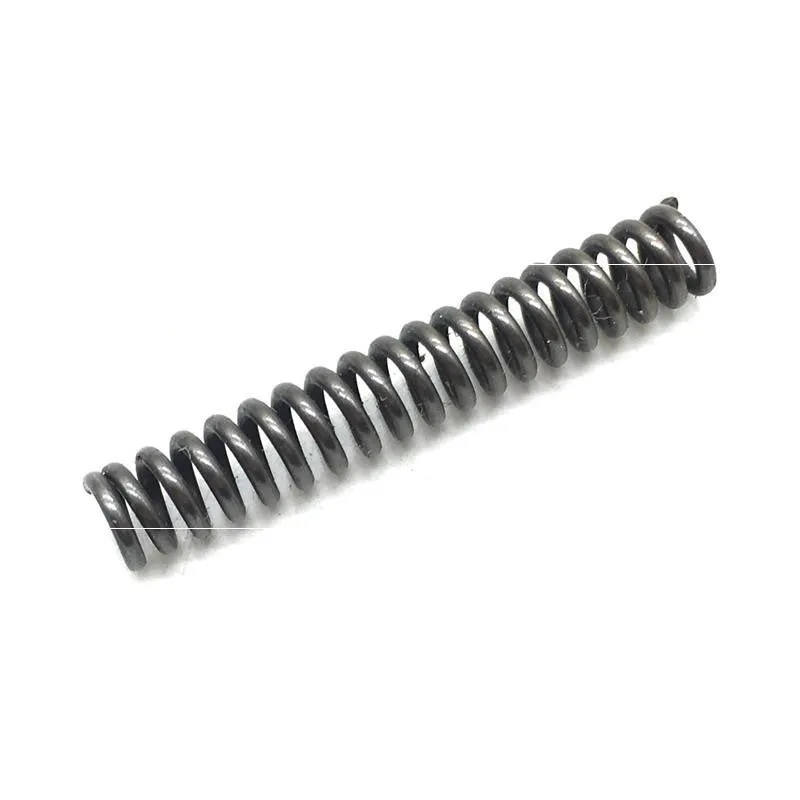 Set of metal pneumatic belt machine accessories including rollers, blades, a switch, and couplings on a workbench.