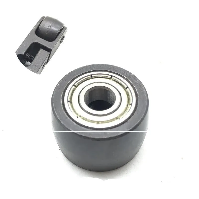 Set of metal pneumatic belt machine accessories including rollers, blades, a switch, and couplings on a workbench.