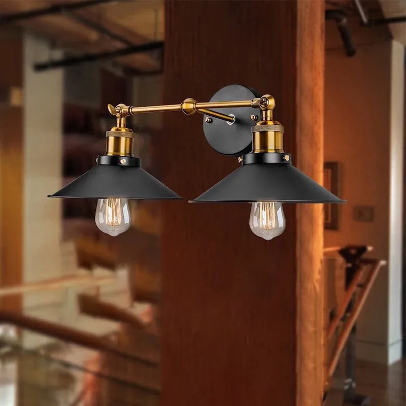 Black double head American retro industrial style iron wall lamp on a dark wall.