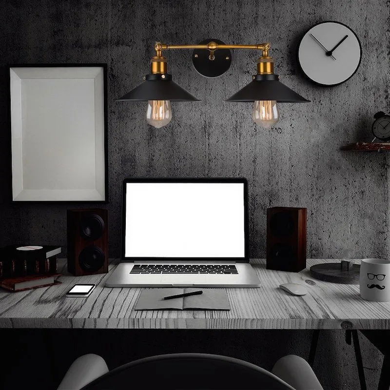 Black double head American retro industrial style iron wall lamp on a dark wall.