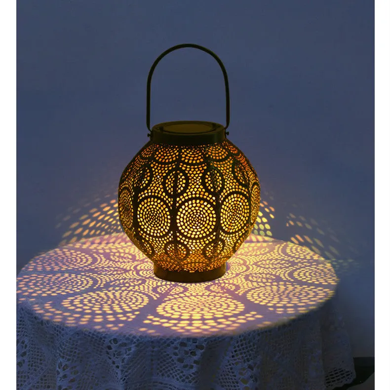 Solar powered outdoor courtyard lamp with decorative iron hollow design and integrated solar panel