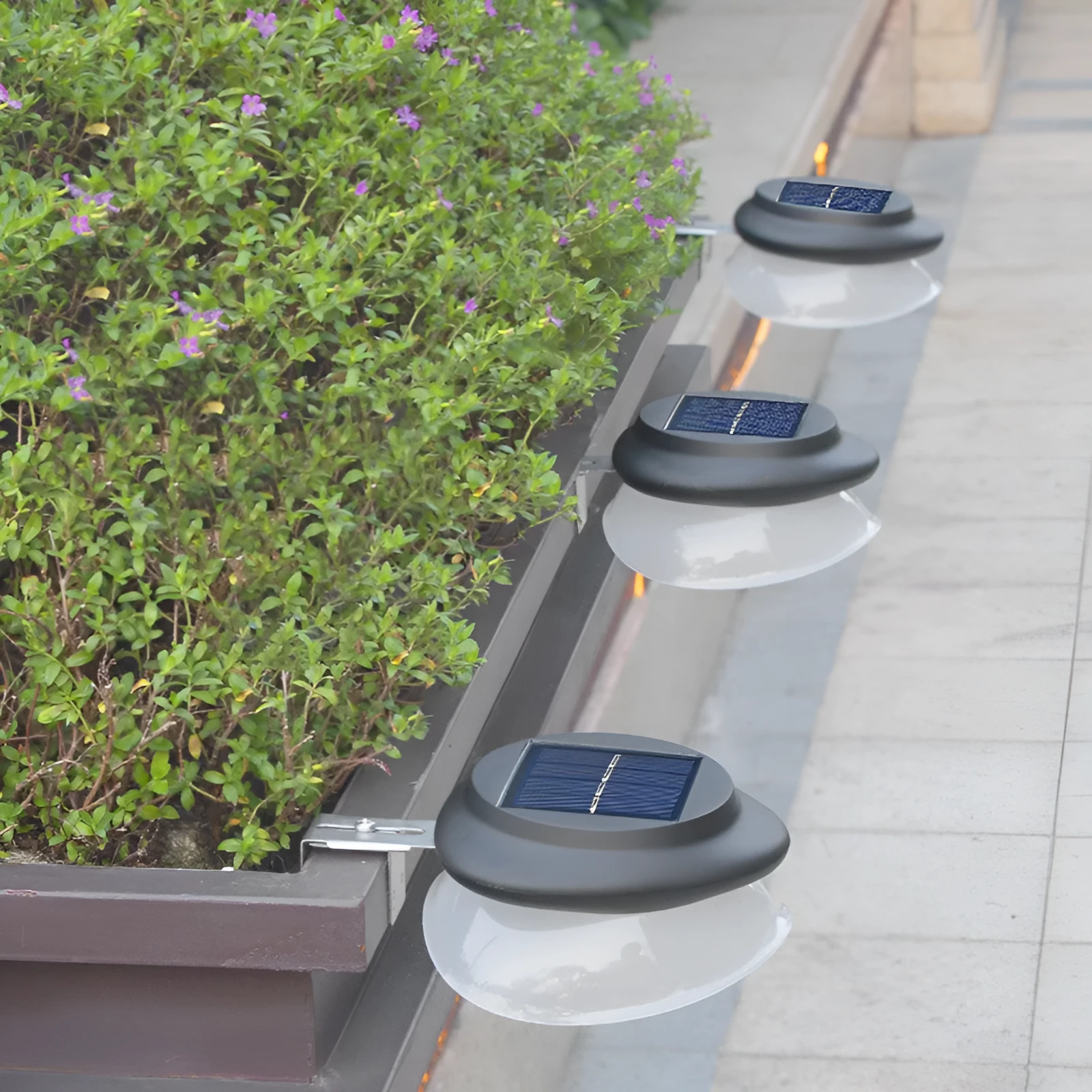 Solar-powered outdoor fence wall lamp with Southeast Asian design mounted on garden fence