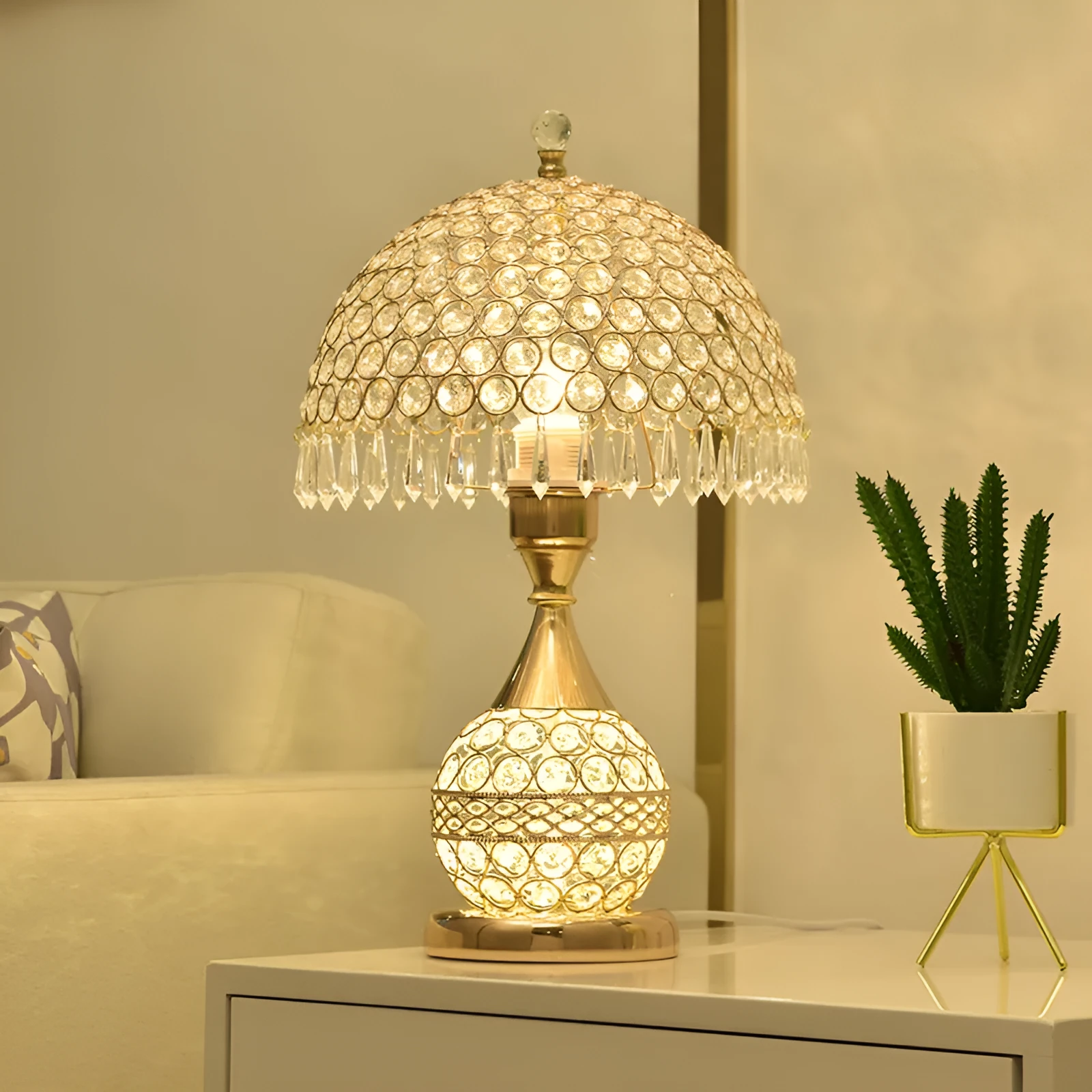 Gold crystal desk lamp with hand-finished pendant and iron art base on wooden surface