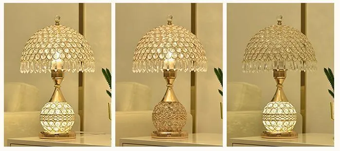 Gold crystal desk lamp with hand-finished pendant and iron art base on wooden surface