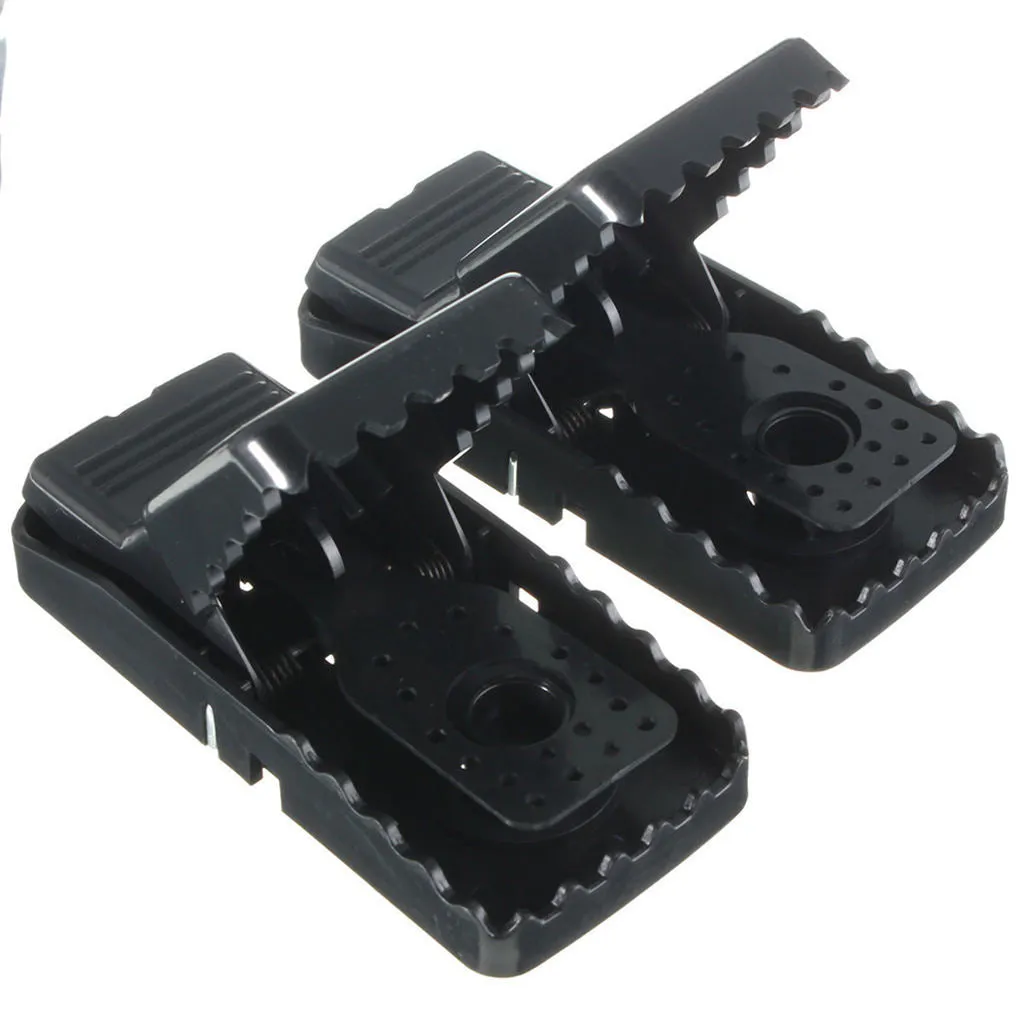 Six black plastic snap mousetraps showing dimensions and smooth surface.