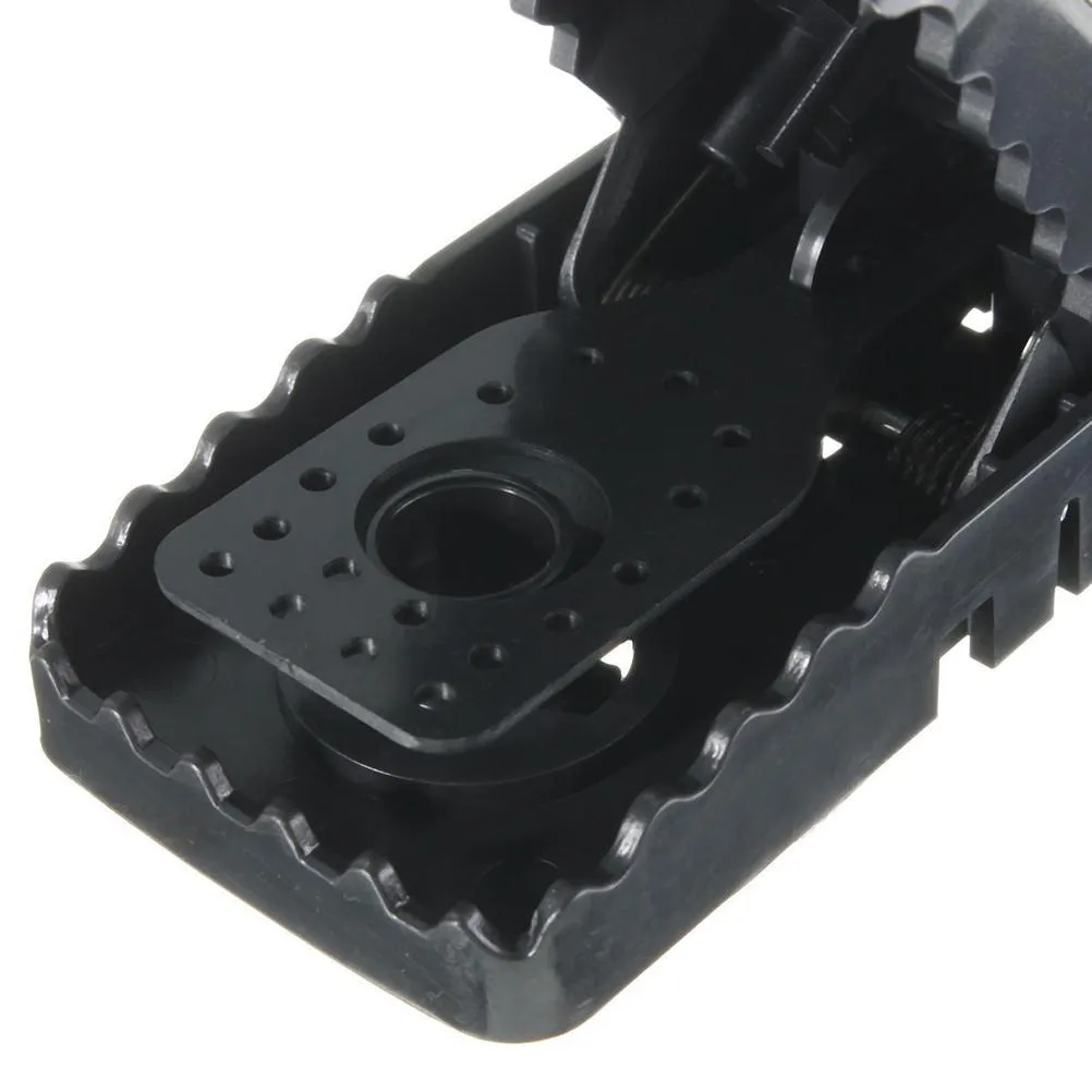 Six black plastic snap mousetraps showing dimensions and smooth surface.