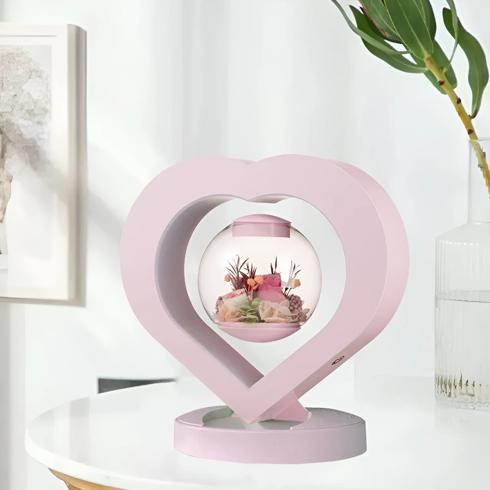 Pink preserved rose ornament with LED lights, shown with and without a decorative base.