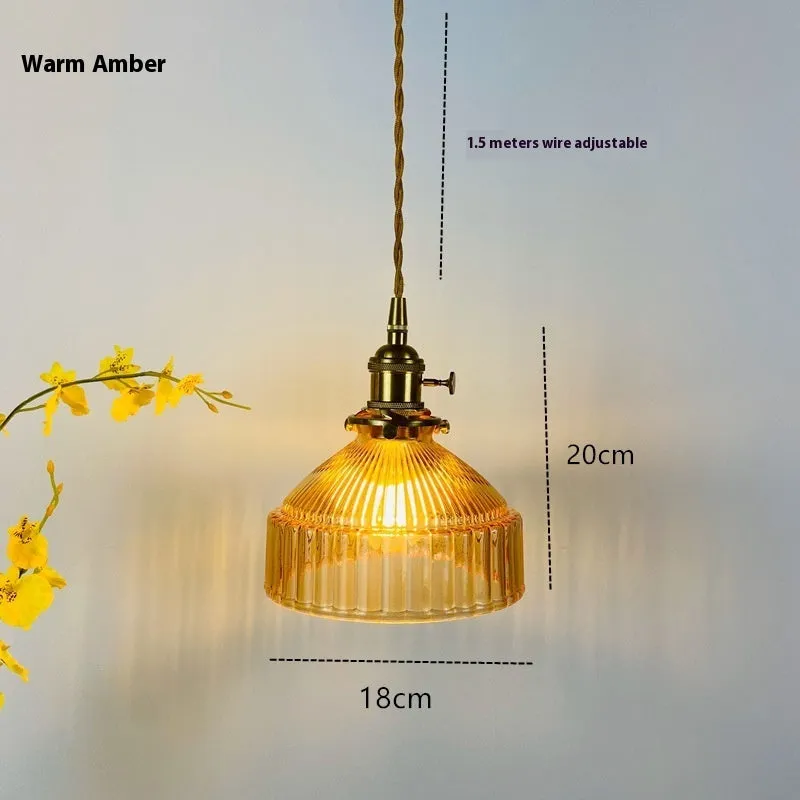 Nordic-style brass and glass chandelier light fixture with an adjustable cord.