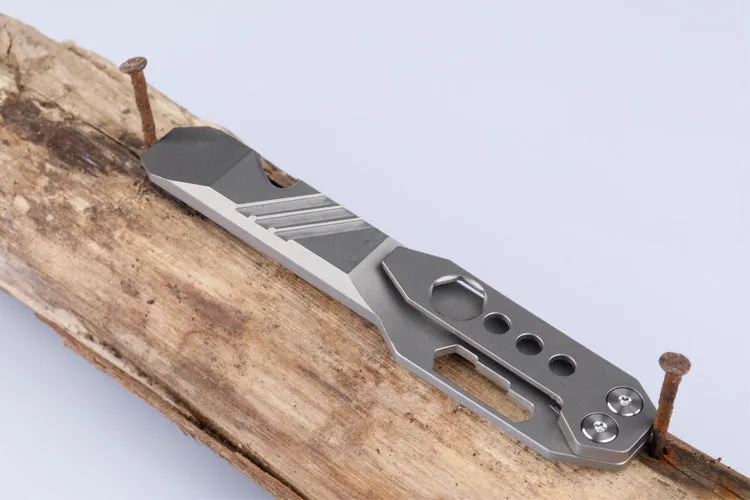 Titanium alloy multi-function crowbar tool with screwdriver tip and bottle opener in stone wash finish.