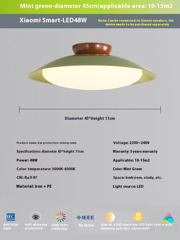 Modern cream style flying saucer shaped ceiling lamp in an iron shade.
