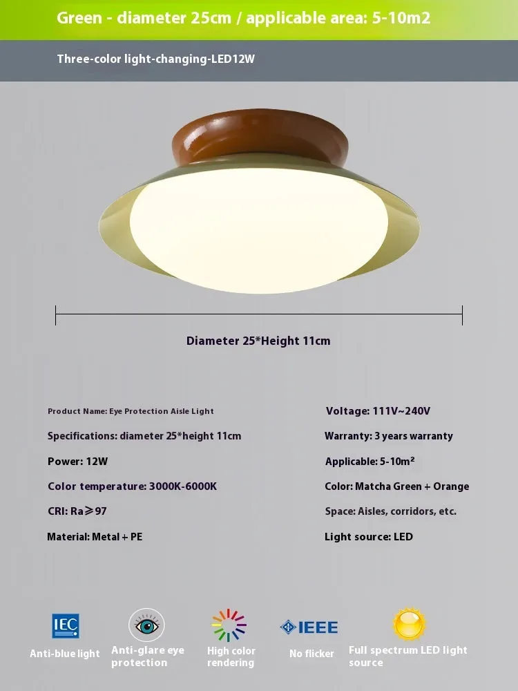 Modern cream style flying saucer shaped ceiling lamp in an iron shade.