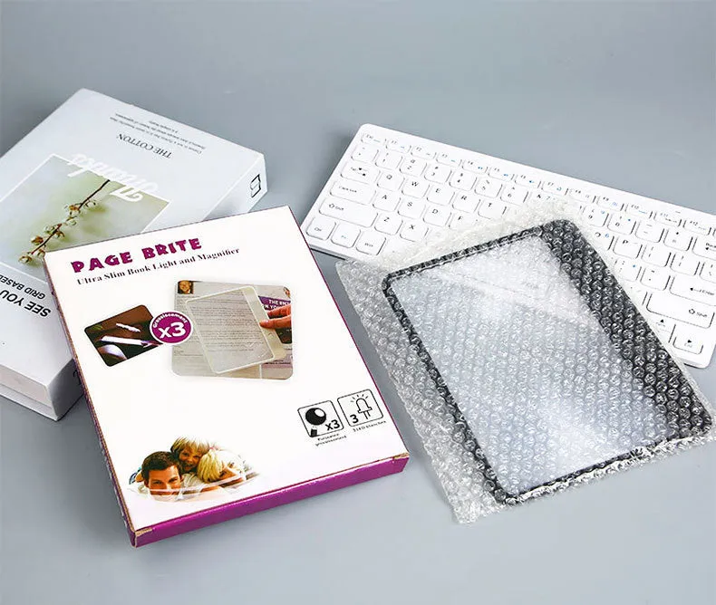 Black or white magnifying glass with integrated LED reading lamp, showing 180x140mm size and 3x magnification lens.