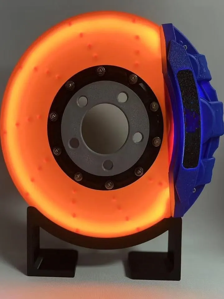 Brake disc themed LED desktop night light in blue caliper colour with touch control