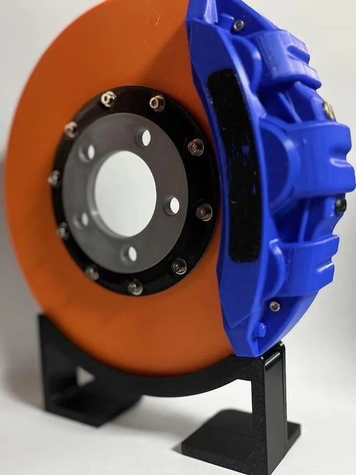 Brake disc themed LED desktop night light in blue caliper colour with touch control