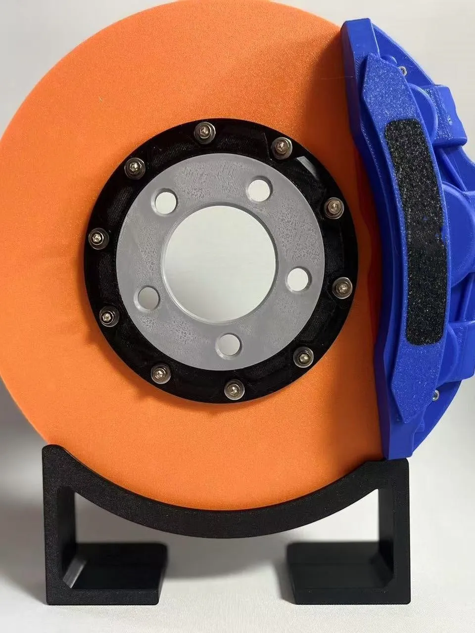 Brake disc themed LED desktop night light in blue caliper colour with touch control
