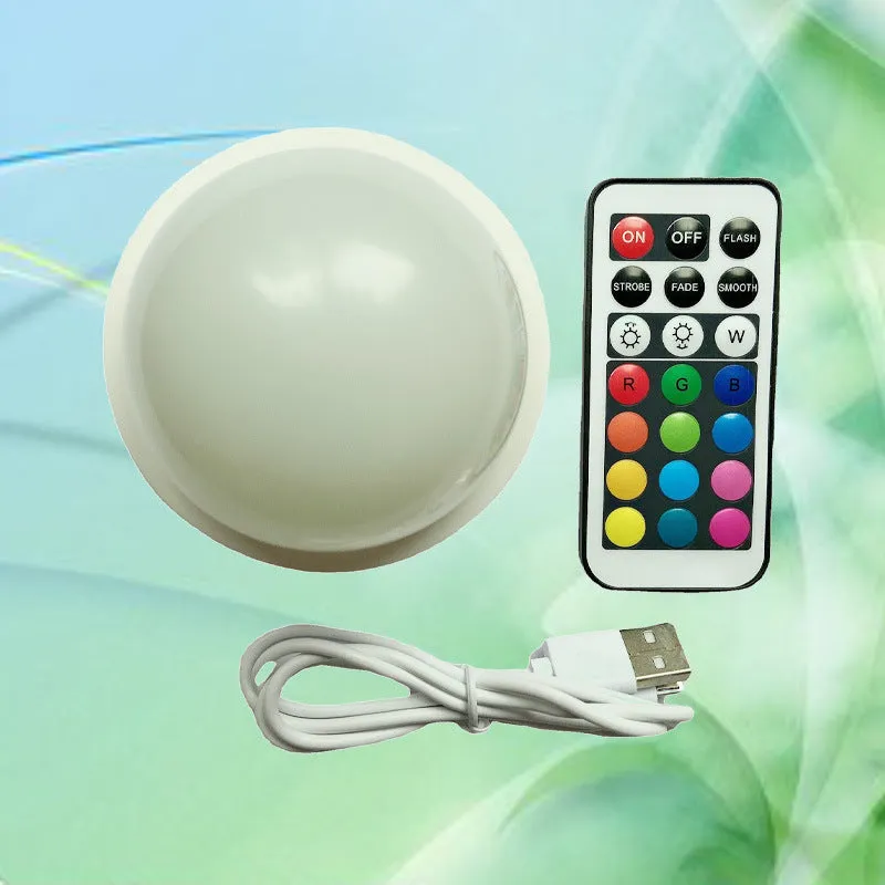 Colourful gradient 3D shooting night light with remote control on black surface