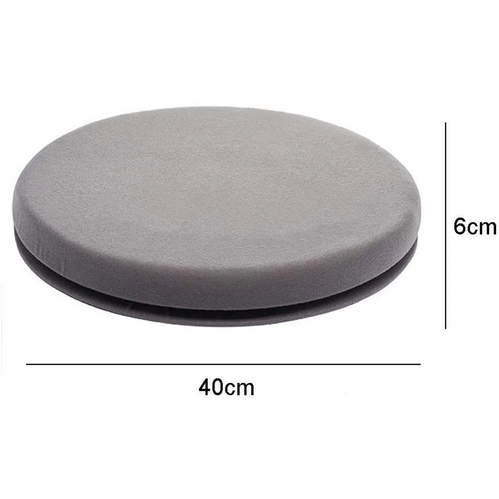 A grey 360-degree rotating car seat cushion on a car seat, showing its non-slip base and plush fabric cover.