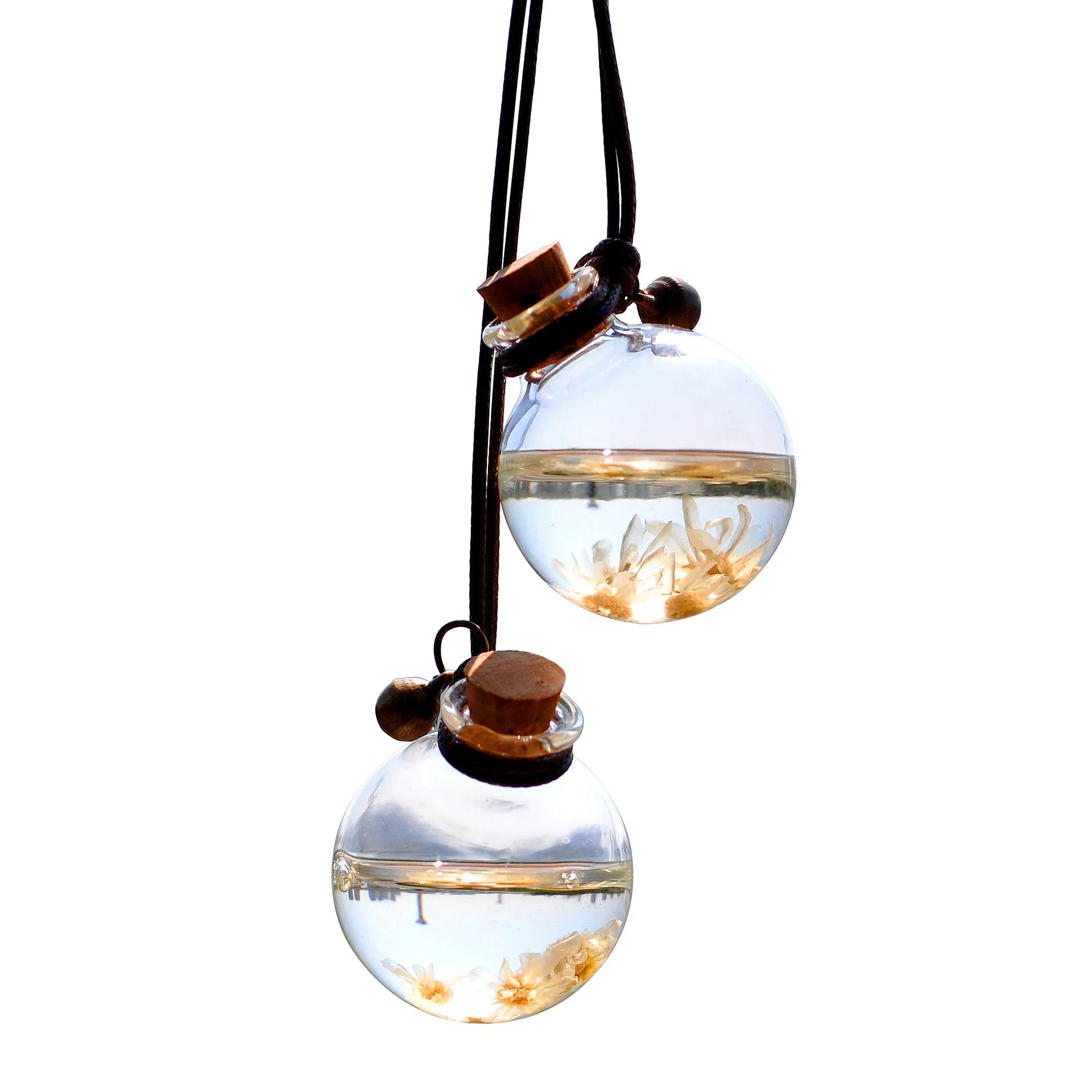 Glass car perfume pendant with preserved flowers inside, shown in a selection of different floral colours.