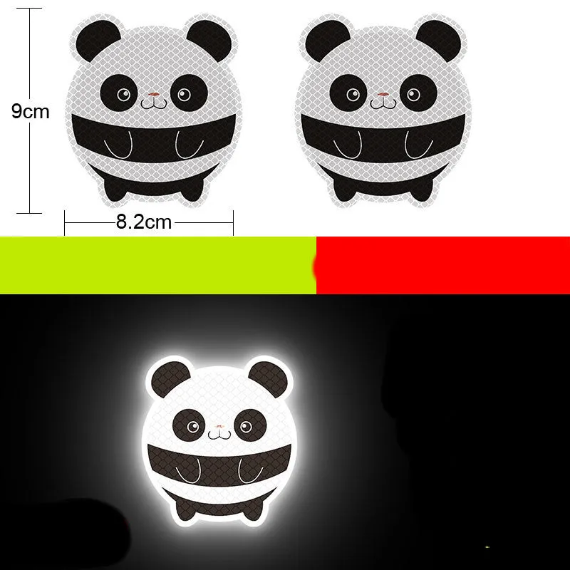 A pair of diamond-grade reflective safety stickers for vehicles, showing sample designs like a smiling cat or tiger.