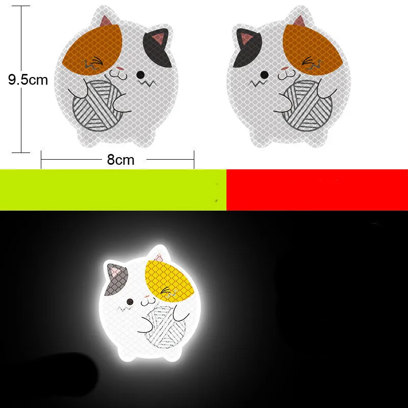 A pair of diamond-grade reflective safety stickers for vehicles, showing sample designs like a smiling cat or tiger.