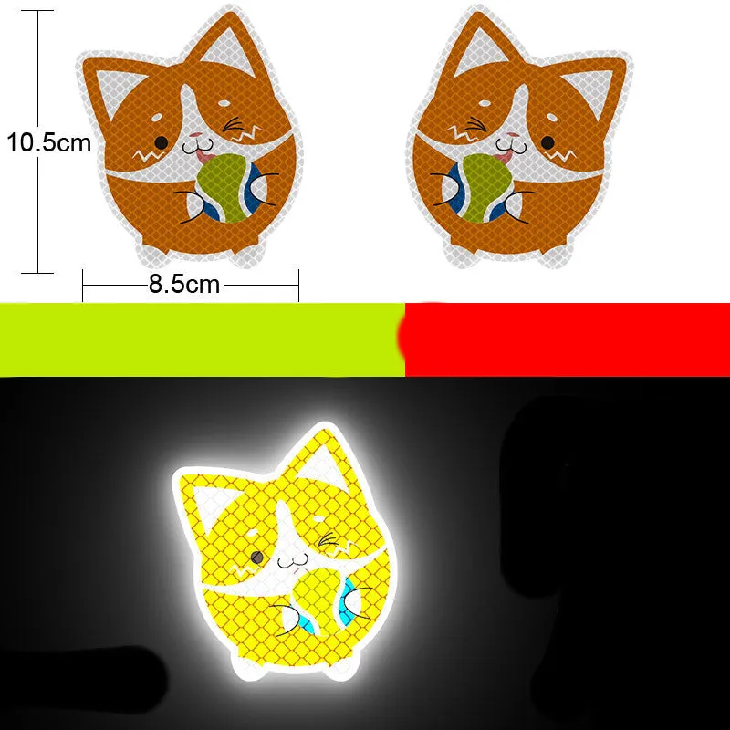 A pair of diamond-grade reflective safety stickers for vehicles, showing sample designs like a smiling cat or tiger.