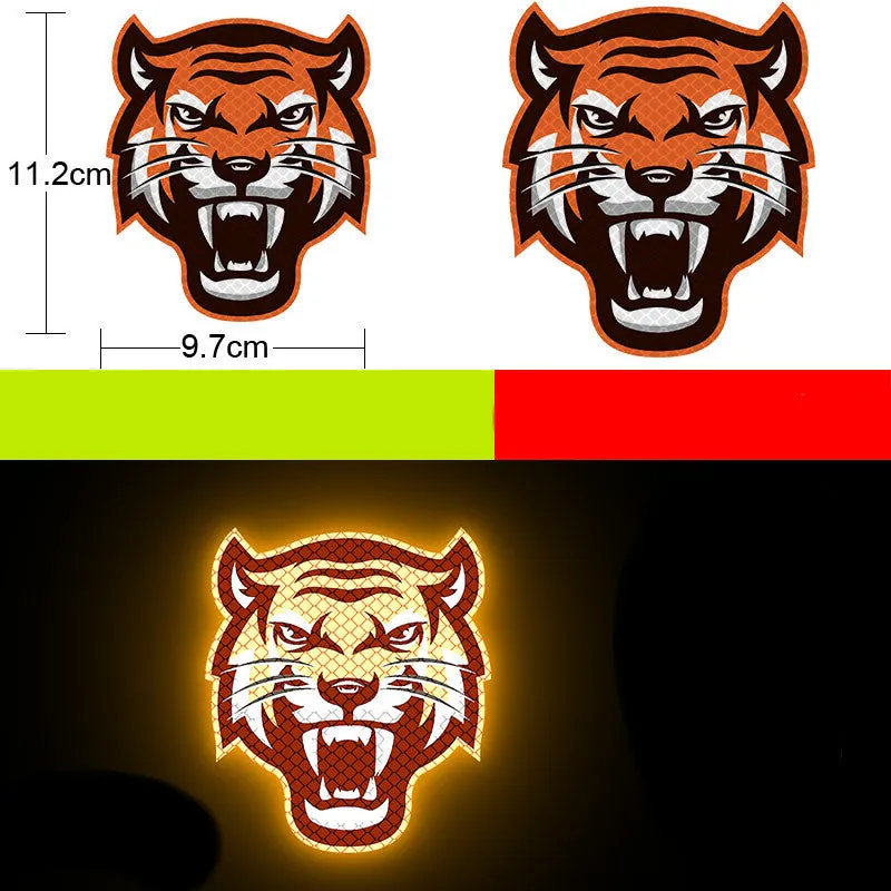 A pair of diamond-grade reflective safety stickers for vehicles, showing sample designs like a smiling cat or tiger.