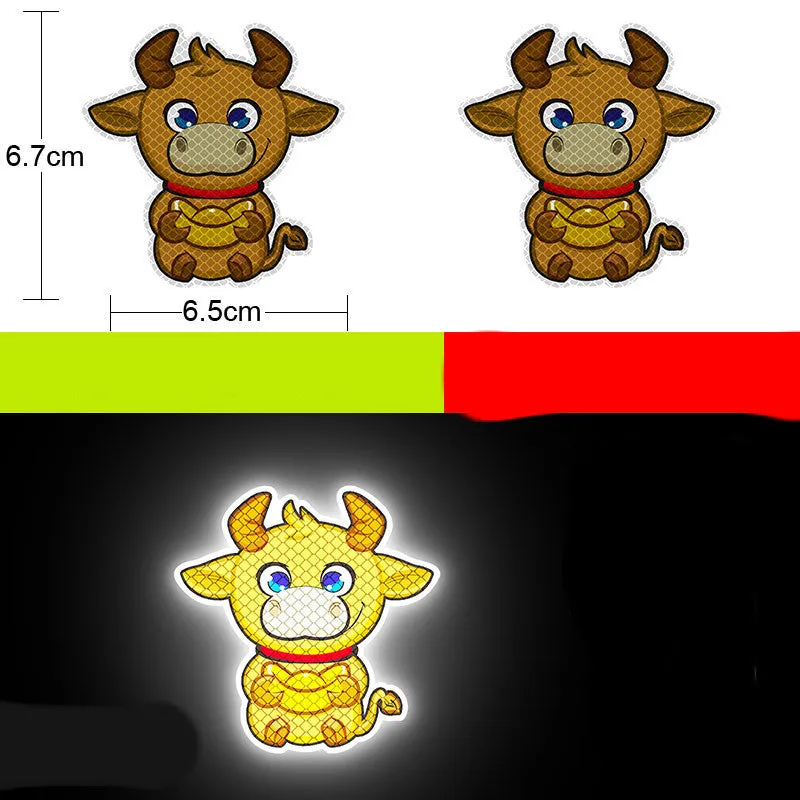 A pair of diamond-grade reflective safety stickers for vehicles, showing sample designs like a smiling cat or tiger.