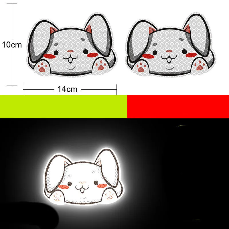A pair of diamond-grade reflective safety stickers for vehicles, showing sample designs like a smiling cat or tiger.