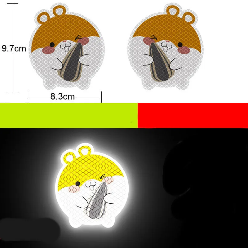 A pair of diamond-grade reflective safety stickers for vehicles, showing sample designs like a smiling cat or tiger.
