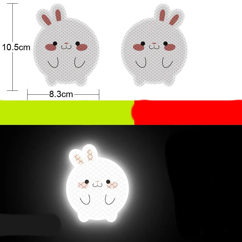 A pair of diamond-grade reflective safety stickers for vehicles, showing sample designs like a smiling cat or tiger.